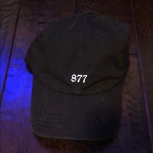 Black “877” dad hat in excellent condition.